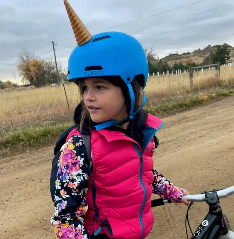 Helmet Flair MagNeatOhz unicorn modeled by a child on a bike