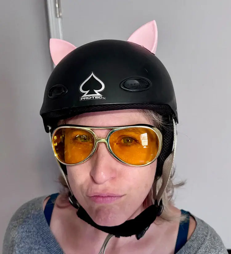 pink cat ear helmet flair modeled on a black helmet