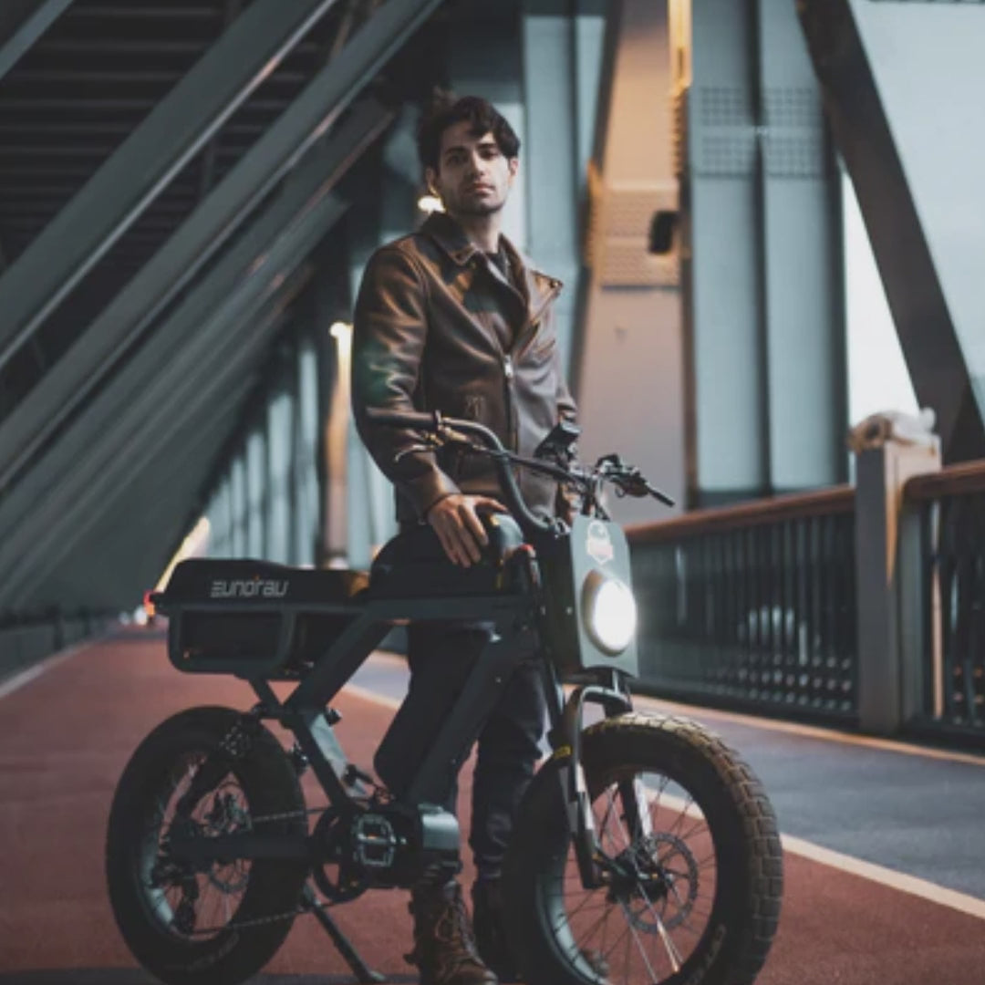 Eunorau flash shown in an urban bridge setting with a male rider in a leather jacket