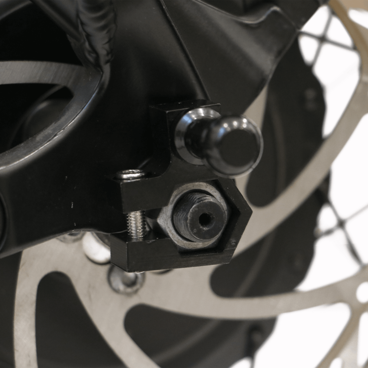 EUNORAU M12 Motor Axle Nut Mount Trailer Hitch Adapter Fit for Hub Motor Ebike shown installed on an ebike rear axle