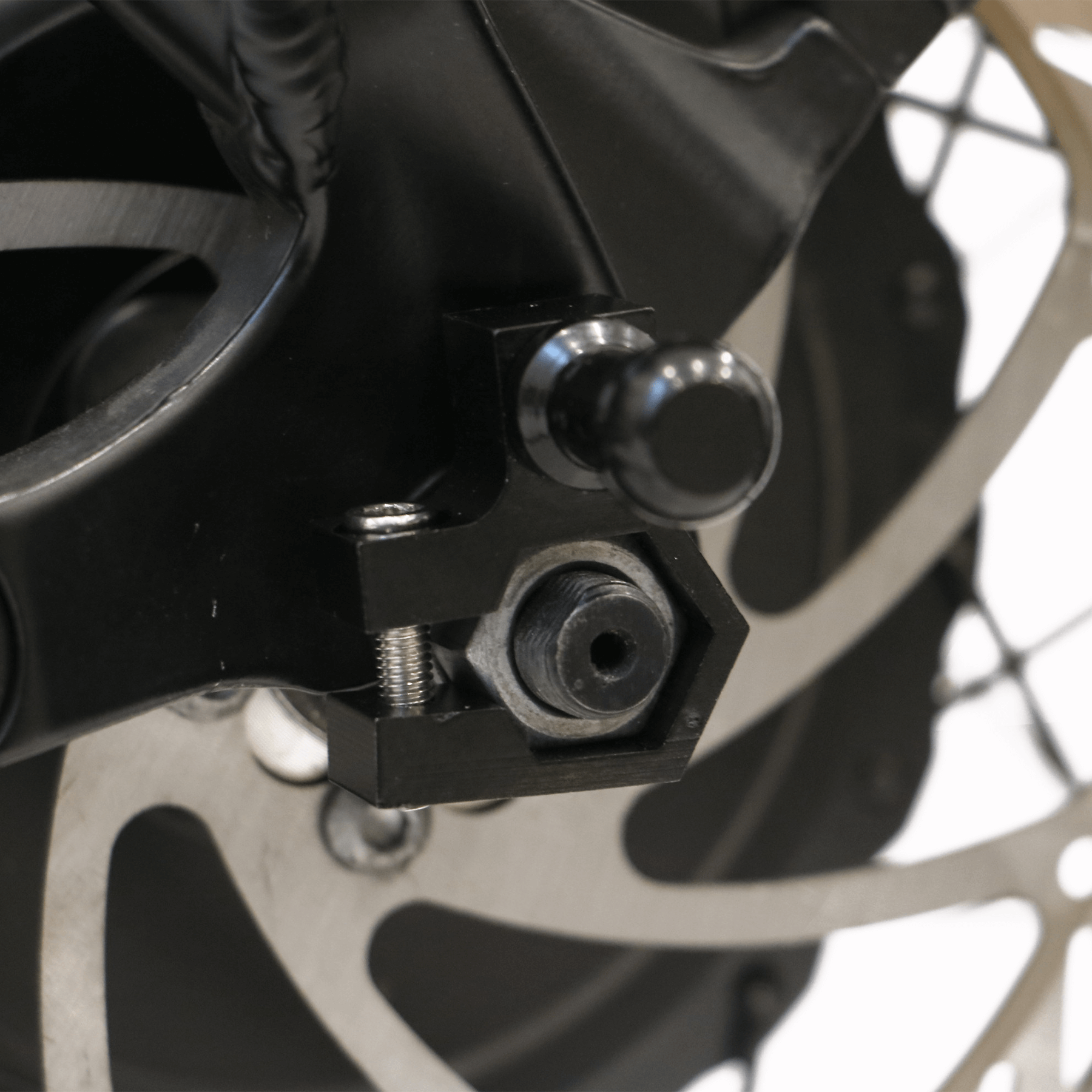 EUNORAU M12 Motor Axle Nut Mount Trailer Hitch Adapter Fit for Hub Motor Ebike shown installed on an ebike rear axle