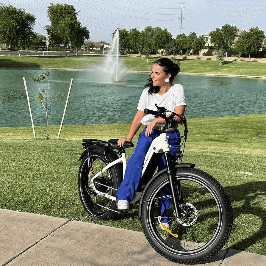 collection image for step-through Ebikes showing a smaller sized woman easily mounting the Senada Mayor Ebike