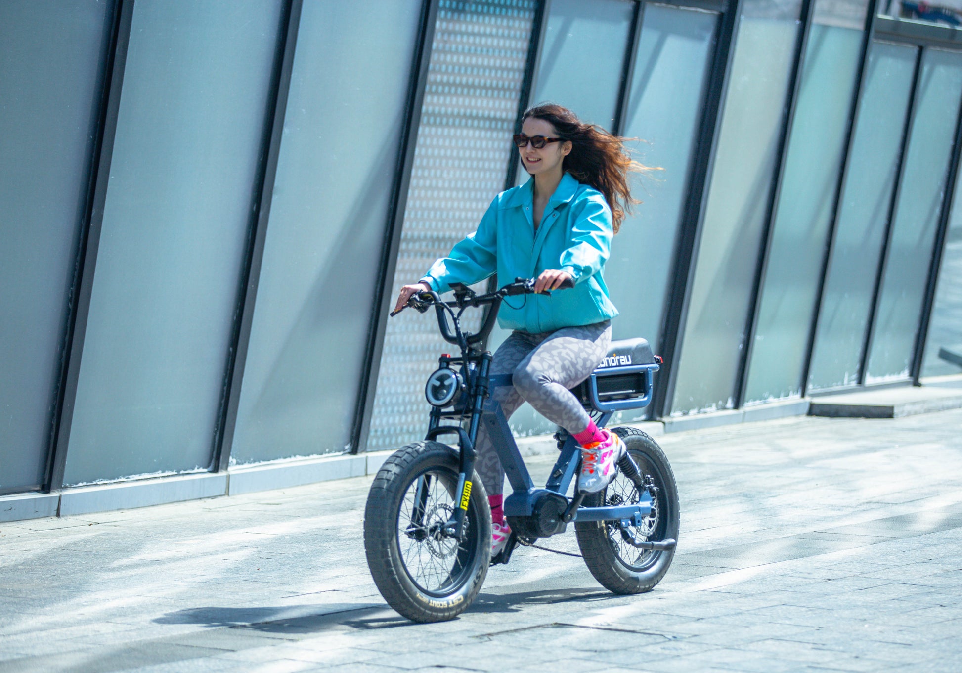 EUNORAU FLASH stylish ebike available in mid drive rear hub drive and all wheel drive with female rider