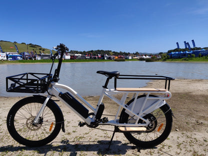 EUNORAU MAX-CARGO electric long-tail cargo ebike with integrated lights and cargo space by a scenic lakeside to demonstrate the joy of the ebike lifestyle