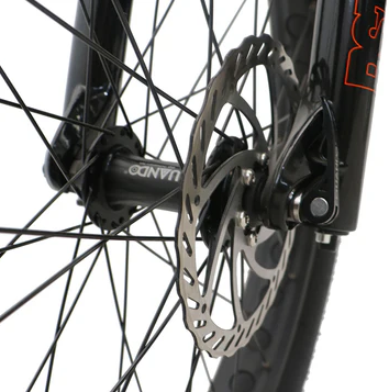 Close-up of Eunorau FAT-HS fat tire ebike's 180mm hydraulic front disc brake and RST front suspension fork