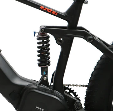 Close-up of the dual suspension and mid-drive motor on the EUNORAU FAT-HS Ebike for tackling steep hills and rough terrain.