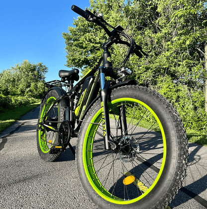 senada viper plus 1000w rear hub motor full suspension ebike shown on a paved greenbelt trail in to demonstrate this electric bicycle as a way to enjoy nature